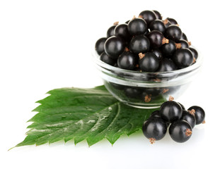 Fresh black currant in transparent bowl isolated on white