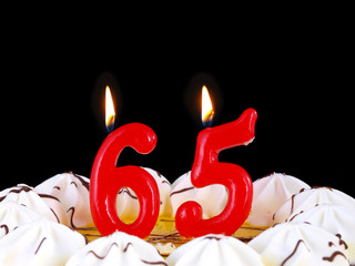 Birthday cake with red candles showing Nr. 65