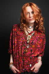 Fashion shot of an beautiful red hair gir