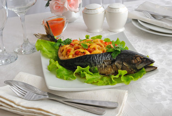 The fish (mackerel), stuffed with vegetables and cheese
