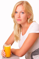 Attractive young woman with a glass of fresh juice