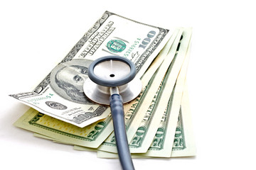stethoscope and US dollar banknote on white background