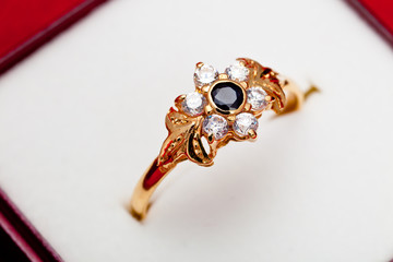 Gold ring with white and blue zirconia enchased © David Acosta Allely