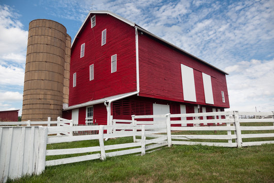 Traditional US red painted barn on farm
