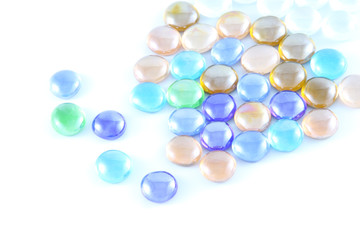 Color glass marble on white background.
