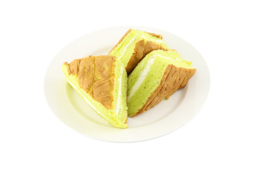 Sponge cream cake dish on white background.