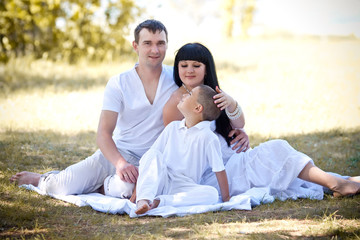 young family with a sun on the nature