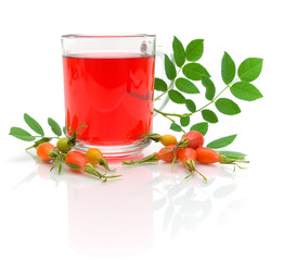 cup of tea with rose hips and berries ripe rose hips on a white