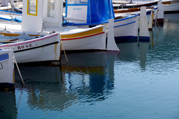 Fototapeta na wymiar fishing boats reflected in the water