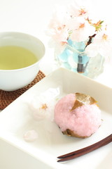 Japanese sweet pink mochi with green tea in spring