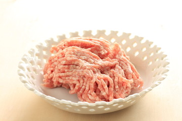 Freshing mince Pork meat in white bowl with copy space