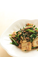 Chinese cuisine, Tofu and mince stir fried on white background