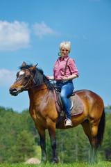 Fototapeta premium happy woman on horse