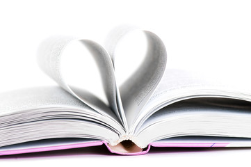 pages of a book curved into a heart shape