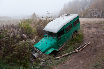 The wood roads which have fallen in a ditch an off-road car