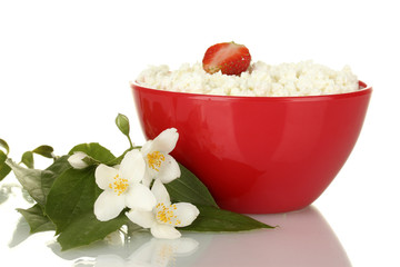 cottage cheese with strawberry in red bowl and flowers