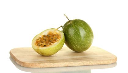 green passion fruit isolated on white background close-up