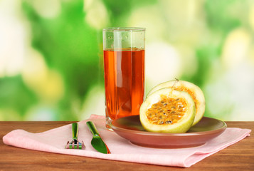 Green passion fruit in the plate on bright green background