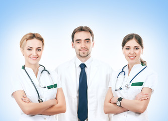Fototapeta premium A team of young Caucasian medical workers in white clothes