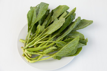 Chinese kale on white dish