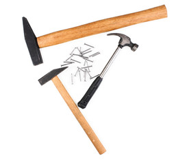 Hammers and metal nails isolated on white