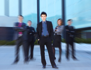 Obraz premium A team of young Caucasian business people in formal clothes