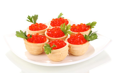 Red caviar in tartlets on white plate isolated on white