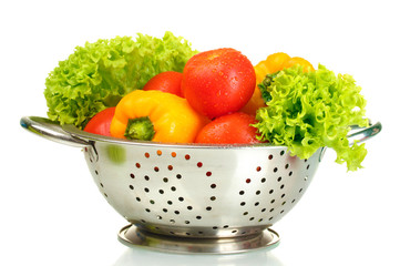 fresh vegetables in silver colander isolated on white