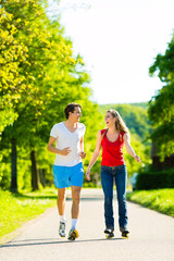 Obraz premium Young couple doing sports outdoors