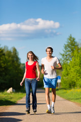 Young couple doing sports outdoors