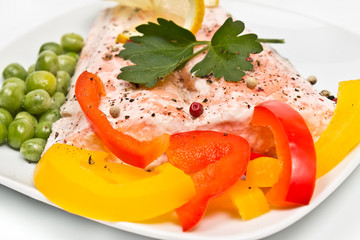 fillet of salmon with vegetables and peas