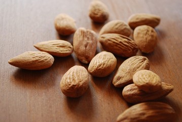 Almonds on wooden background