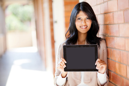 attractive female college student presenting a tablet computer