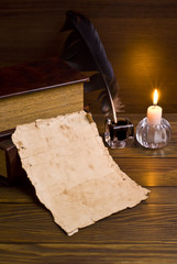 old papers and books on a wooden table