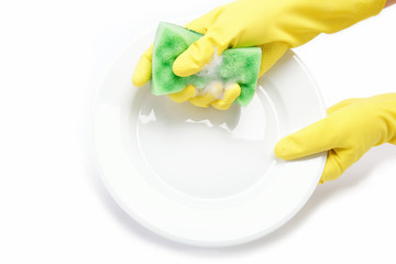 Hands in rubber gloves can sponge the plate on a white backgroun
