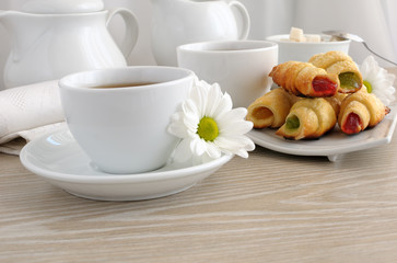 A cup of tea with homemade croissants