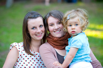 two young women with little girl