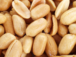 Fototapeta na wymiar Close up of fried, peeled and salted peanuts.