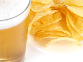 Appetizer with a cold beer and chips.