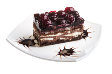 Chocolate cake with cherry on top on a white background