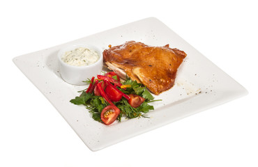 roasted chicken with vegetables on a white plate