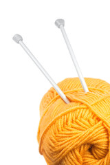 a ball of yarn and knitting needles