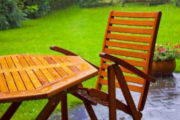 garden table stands in the rain