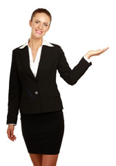 A young woman pointing at something