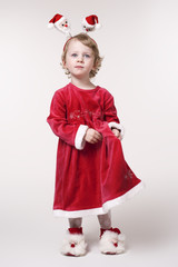 The little girl in a red dress New Year