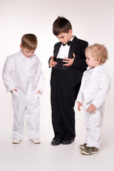 Adorable children in  business suits over white.