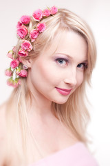 beautiful young pregnant woman wrapped into pink fabric