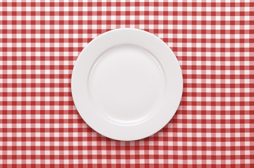 Empty plate at classic checkered tablecloth