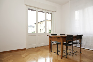 interior, white diningroom, wooden table and black chairs