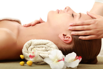 A young woman getting spa treatment, closeup